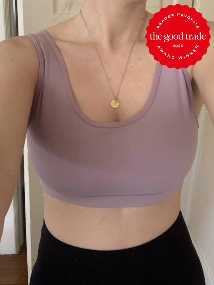 Person wearing a mauve sports bra and black pants. A red badge says "Reader Favorite. The Good Trade. Award Winner. 2025.