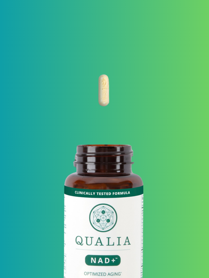 Bottle of Qualia NAD+ supplement with a single capsule above it against a green to blue gradient background.